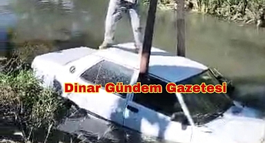 Dinar'da bir otomobil su kanalına düştü